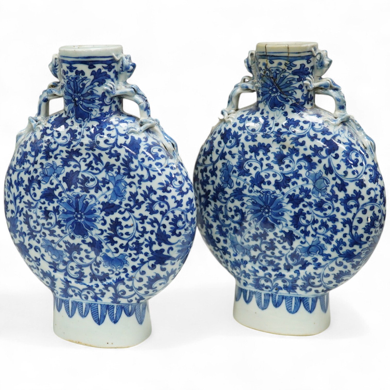 A pair of late 19th century Chinese blue and white moon vases, 23cm. Condition - one vase poor